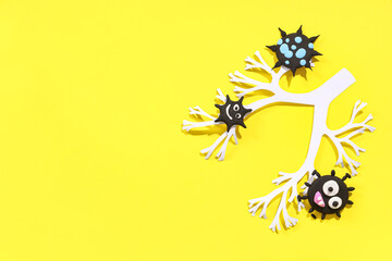 Paper lungs with plasticine viruses on yellow background