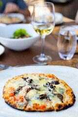 Gourmet pizza with wine.
