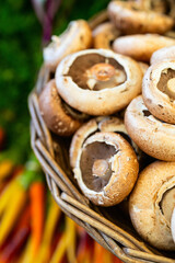 Fresh portobello mushrooms in wicker basket