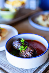 Meatballs in tomato sauce.