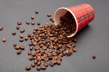 Paper cup and roasted coffee beans	