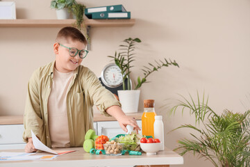 Overweight boy with meal plan and healthy food at nutritionist's office. Diet concept