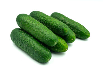 Fresh green cucumbers on a white background