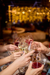 Cheers to a Fantastic Celebration Friends Joyfully Toasting with Wine Glasses in Hand