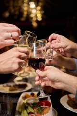 Cheers to a Fantastic Celebration Friends Joyfully Toasting with Wine Glasses in Hand