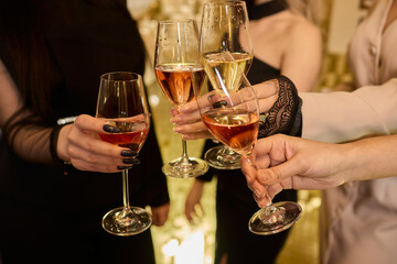Cheers to a Fantastic Celebration Friends Joyfully Toasting with Wine Glasses in Hand