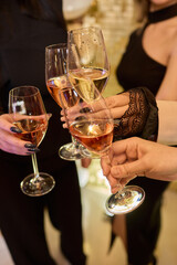 Cheers to a Fantastic Celebration Friends Joyfully Toasting with Wine Glasses in Hand