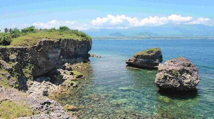 Coastal rock formations, clear water, island view, sunny day, travel brochure