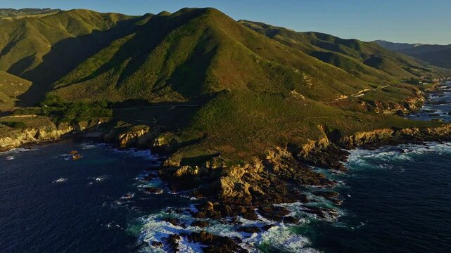 Big Sur Soberanes Point.  Panning to the left revealing rugged Pacific coastline during low tide. Pt Sur in the distance