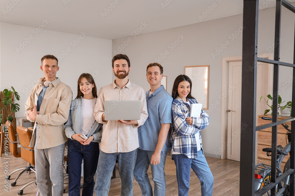 Wall mural team of programmers with laptops in office