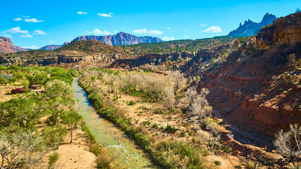 Aerial of Zion Canyon River and Red Rock Cliffs