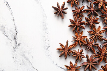Many anise stars on white background