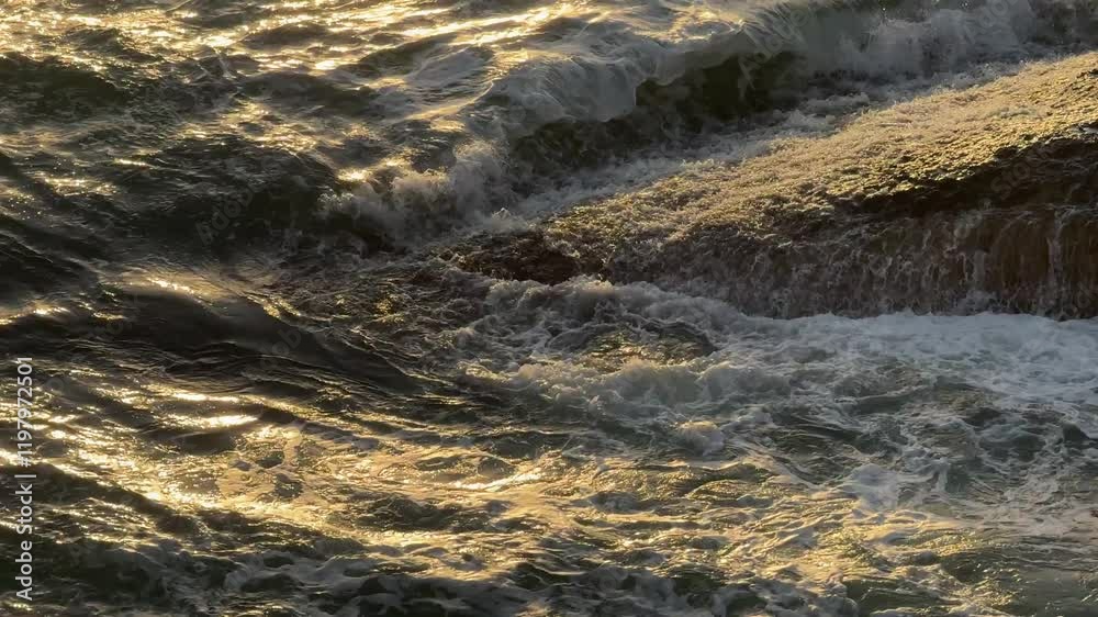 Wall mural Storm sea waves crashing on the coast in evening.