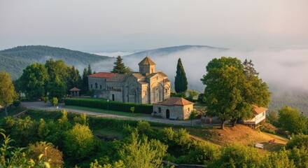 Obraz premium Stone church with scenic forested mountain view at sunrise