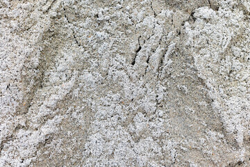 Rough texture of light grey sand with fine grain details