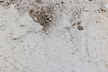 Rough texture of sandy surface with mixed soil elements