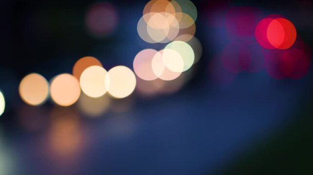 Out of focus car lights on late afternoon