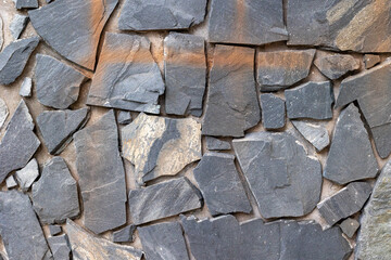Natural stone wall texture with irregular slate pattern