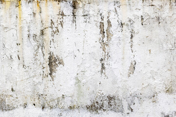 Weathered white concrete wall with natural texture and stains