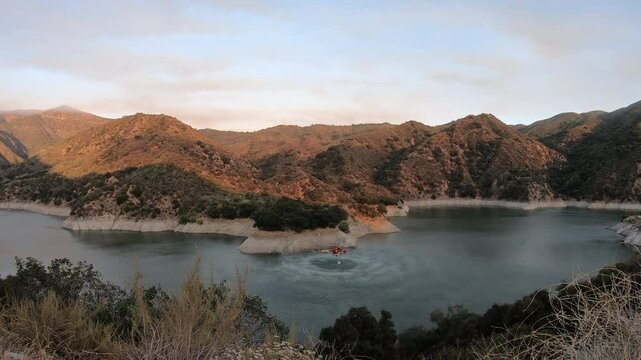 4k video of the California wild fires with helicopters picking up water