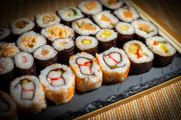 Traditional Japanese food made from rice and fillings rolled in seaweed and sliced into pieces