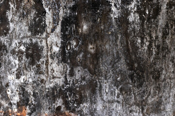 Weathered and textured grungy concrete wall surface