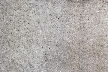 Close-up of textured concrete surface with small pebbles
