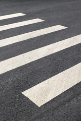 Close-up of pedestrian crosswalk on asphalt road