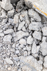 Cracked concrete rubble with textured gray surface showing signs of wear