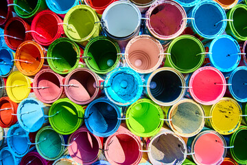 Vibrant Paint Cans in Grid Pattern Top-Down View