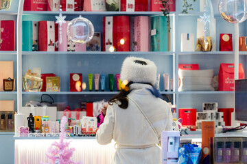Young woman in cosmetics store