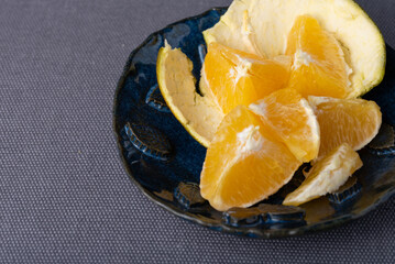 juicy fresh orange wedges in a bowl. Healthy snack.