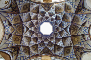 Panorama of amazing geometric patterns of ceilings of Bakhshi Caravanserai in Kashan, Iran....