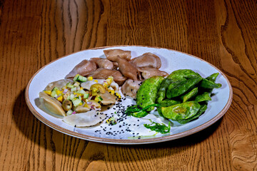 A plate of food on a wooden table