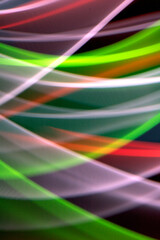 Neon Rainbow Light on Black Background Abstract Lines Swirls and Waves