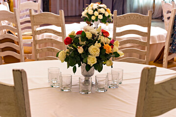 A vase of flowers sitting on top of a table in a room