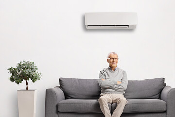 Fototapeta premium Elderly man resting on a sofa