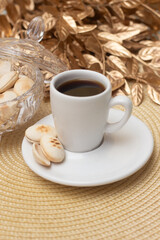cup of coffee with cookies.