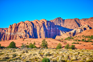 Towering Red Cliffs and Desert Vegetation Snow Canyon Eye-Level View