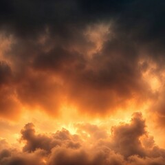 Obraz premium Dramatic sky with dark clouds illuminated by a bright golden light.