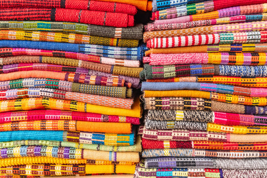 Colorful traditional woven cloth for sale at a market near Lake Atitlan.