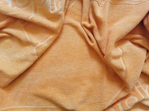 Vibrant Details Crumpled Orange Towel Close-Up