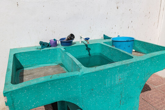 Green public laundry washing sink in Santa Cruz la Laguna.