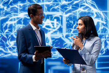 AI researcher and colleague working with artificial intelligence neural networks in modern lab....