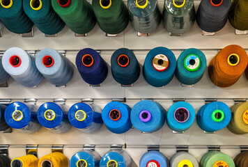 Colorful Thread Spools
Wall of Threads
Textile Factory Storage