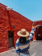 Latin tourist visits the Monastery of Santa Catalina on a sunny day, Arequipa, Peru