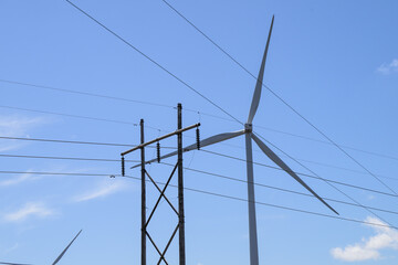 Giant wind turbine windmills with electric power lines
