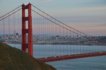 The sun sets on the Golden Gate Bridge at the mouth of the San Francisco Bay