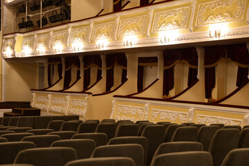 Rows of gray comfortable seats in theatre