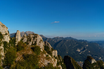 Panoramic view of lakes and surrounding mountains near Belvedere del Parco Valentino at Piani Resinelli, Valsassina, Italy. Aerial view of province of Lecco, near Monte Coltignone and Cima Paradiso